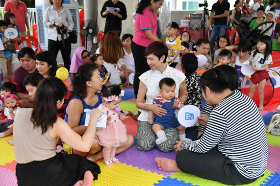 Minister Josephine Teo interacting with families during the mass parent-child activity.
