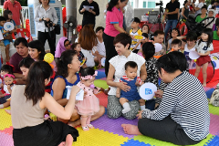 Minister Josephine Teo interacting with families during the mass parent-child activity.