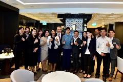 Minister Josephine Teo with senior management and hotel staff.