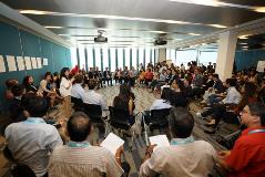 Panel members exchanging views during the conversation circle