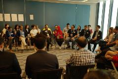 Panel members exchanging views during the conversation circle 2